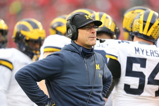 Michigan AD Manuel says Harbaugh not leaving for NFL