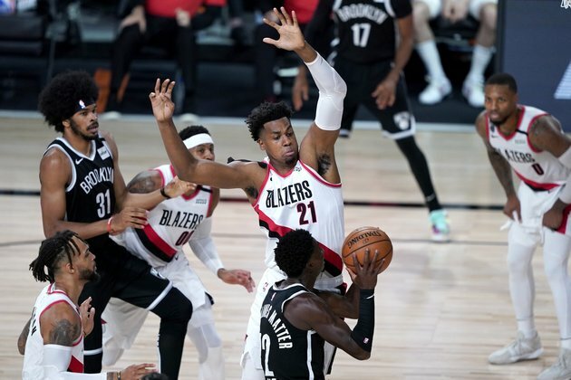 Lillard, Blazers rally past Nets to clinch play-in spot