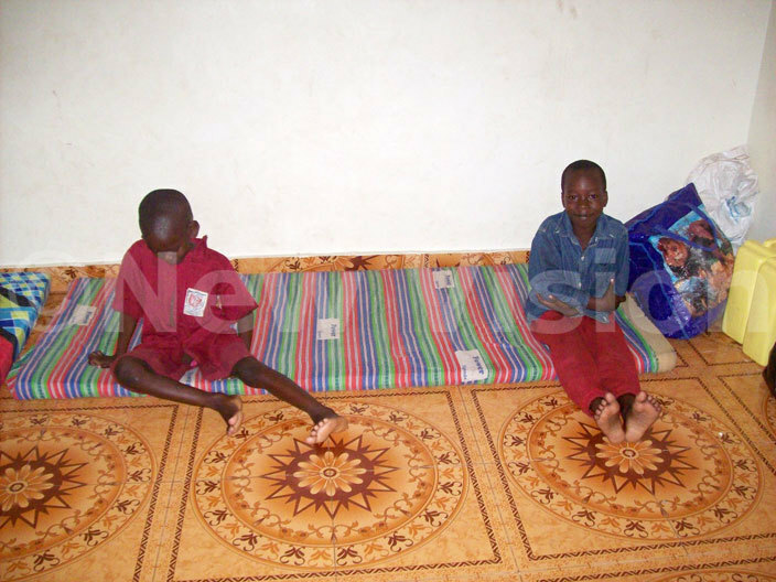 hildren seated on their mattress at itakules residence in usei 