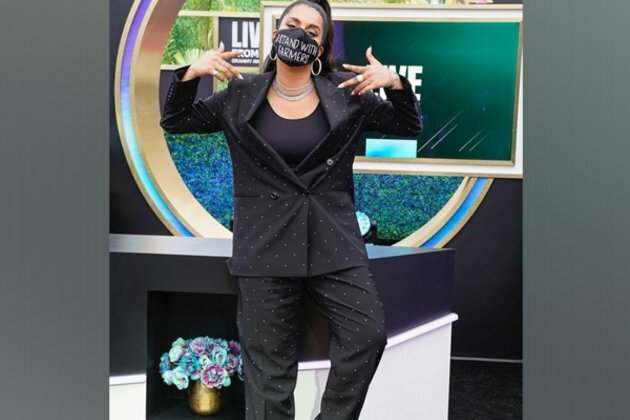 Lilly Singh wears "I Stand With Farmers" mask at Grammys