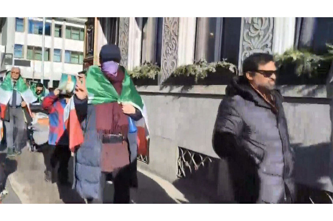 Iranian nationals protest outside World Economic Forum venue in Davos