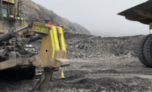 The truck operator assumed the dozer was clear without waiting for positive communication from the dozer operator.