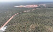 Mine site access road with process plant in the background (mid-January 2023)