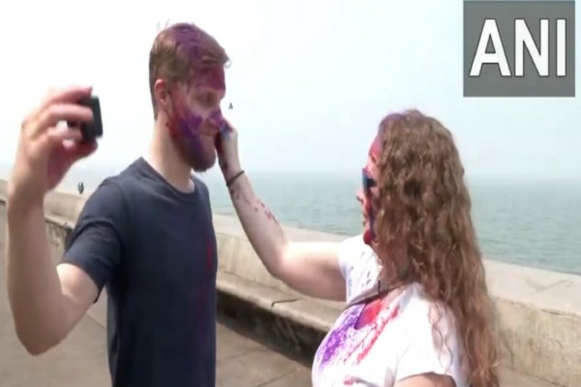 Foreign tourists join Holi celebrations across India