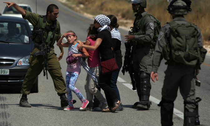 Two Palestinian women charged for slapping Israeli soldiers Two Palestinian women charged for slapping Israeli soldiers