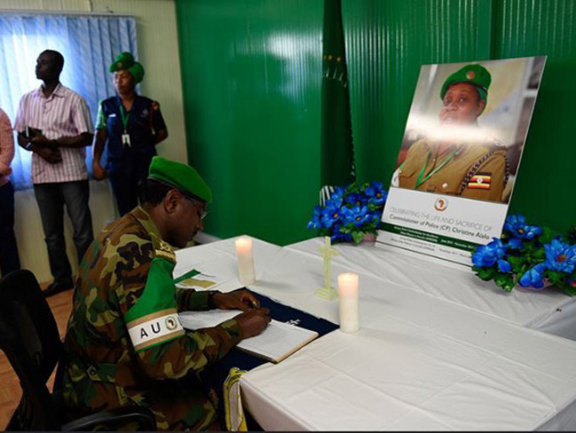    staff signs condolence book in honour of hristine lalo  hoto
