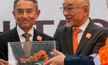 Zambian President Hakainde Hichilema of the Republic of Zambia, Hitachi Construction Machinery Zambia president Nobuhiko Saito,  and Eiji Fukunishi, Hitachi Construction Machinery’s mining business president