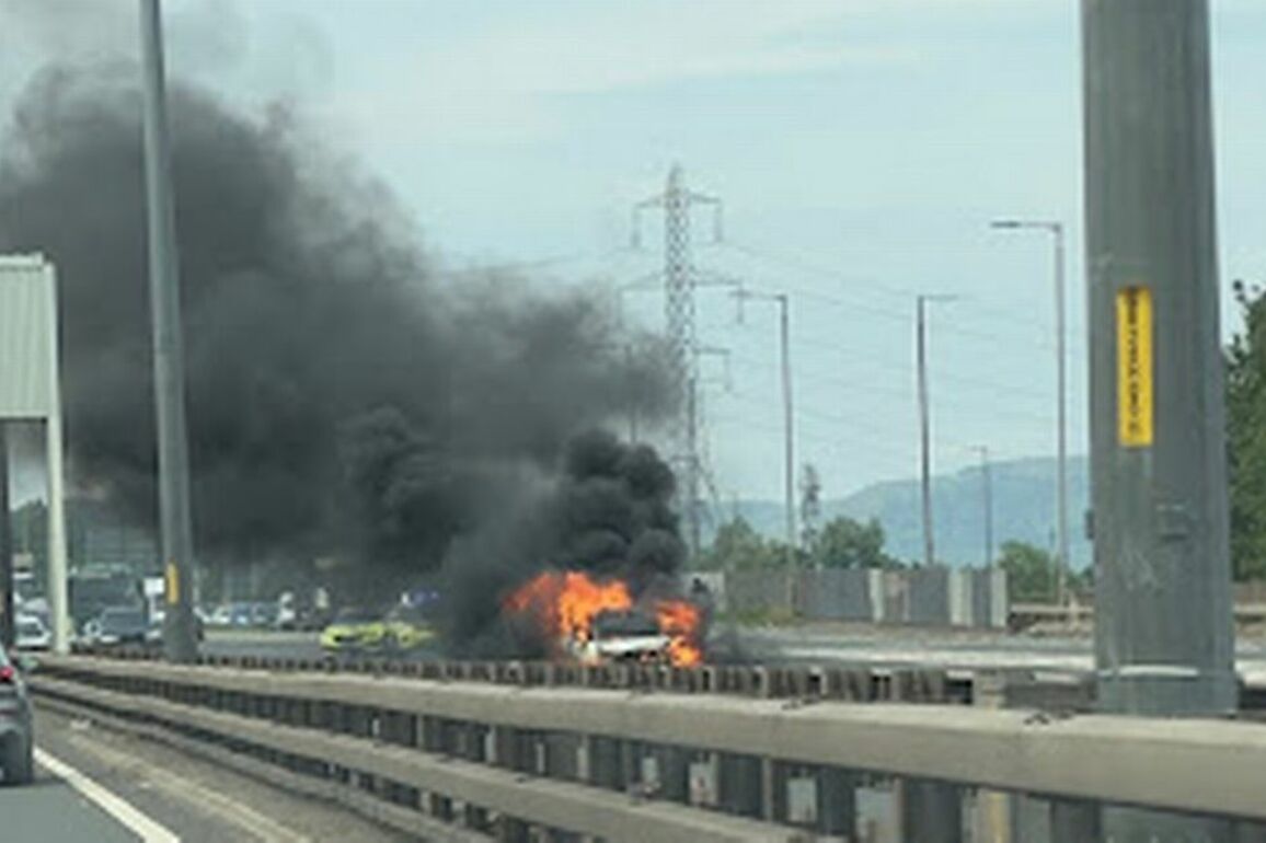 Car bursts into flames on M8 as firefighters battle to control blaze