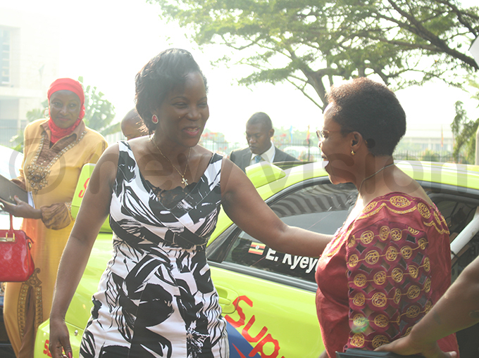 usisi ushers ampala minister eti amya after she was taken on a spin in a rally car hoto by achael assuuna
