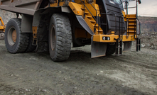 Caterpillar quarry truck transporting iron ore in Kazakhstan