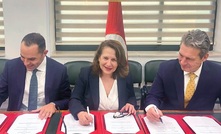 PhosCo MD Taz Aldaoud, Minister of Industry, Mines & Energy Fatma Thabet Chiboub and EBRD's Mark Davis sign the MoU.