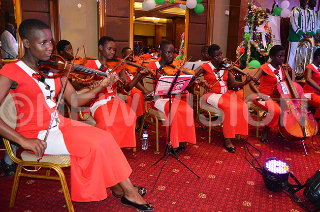  string ensemble from altec cademy akerere performing a musical item 