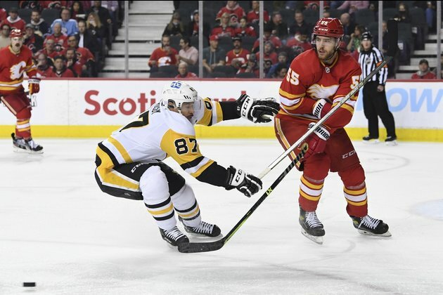 Flames edge Penguins after 7-round shootout