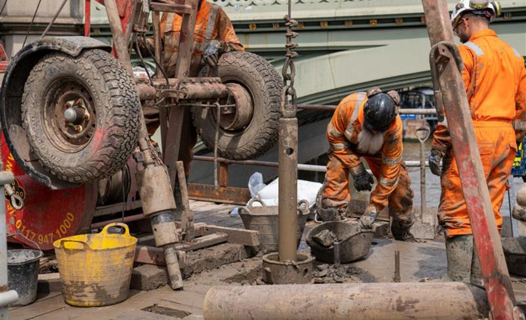 Engineers from Structural Soils conducted overwater drilling beside the Palace of Westminster using a jack-up barge on the River Thames