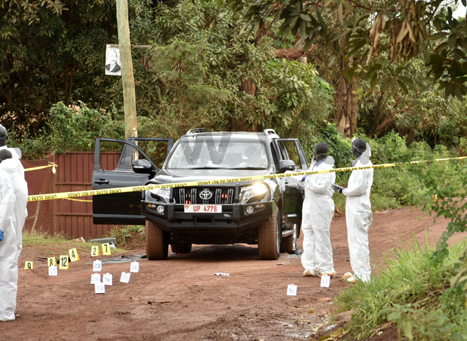  forensic team combs the crime scene where ndrew elix aweesi his bodyguard and driver were gunned down this morning hoto by oderick himbazwe