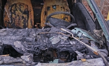 Burnt Electric Car Wreck with Melted Interior and Tires Caused by Battery Fire