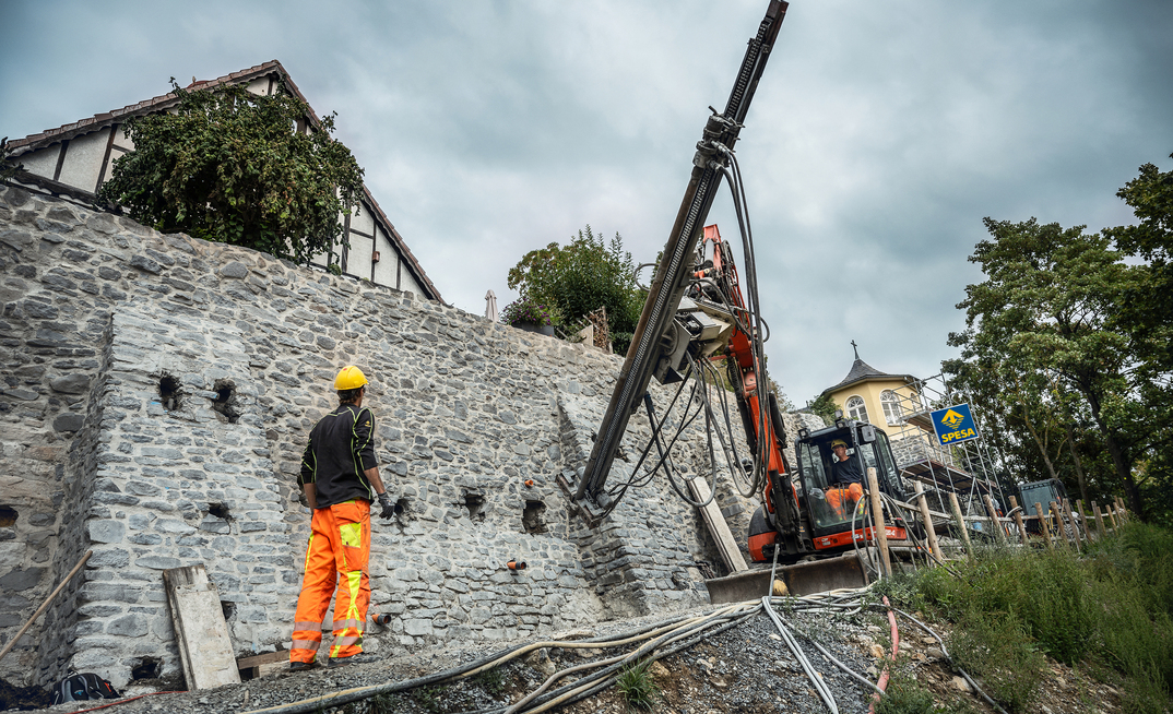 Injection boreholes and masonry nails were installed along with structural reinforcement using self-drilling anchors