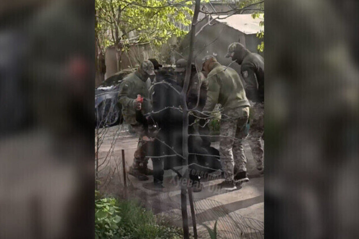 Ukrainian draft enforcers pepper-spray woman 
