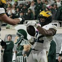 Justice Haynes (2 TDs), carries No. 25 Michigan past Michigan State
