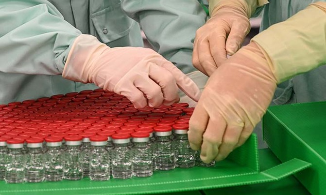 Vaccine trial resumes as virus continues grim march Vaccine trial resumes as virus continues grim march
