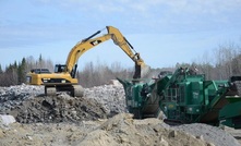 Excavation and screening of stockpiled ore at Mirado