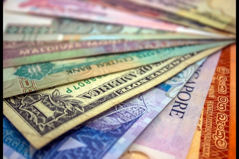 Greenback slides amid tax bill fears, trade deal uncertainty
