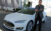 Elon Musk stands with a Tesla electric car. Photo: Maurizio Pesce