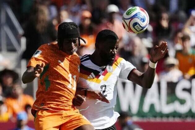 Late strike gets Germany past Ivory Coast, into knockout round