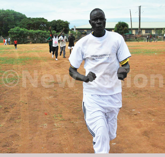  obert kumu the ebbi district 5 chairperson arrives after completing the 8km race 