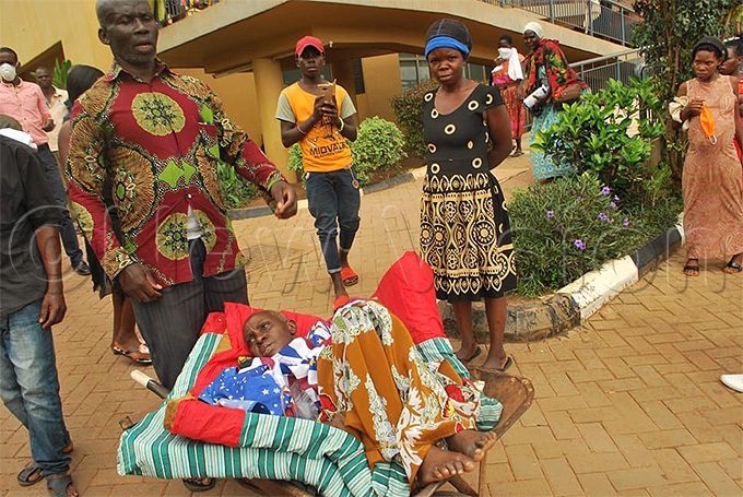  ugangas sickly sister lying  in a wheelbarrowhoto by eginah alunga