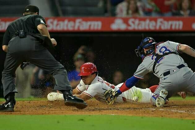Angels bash three homers, end Rangers' winning streak