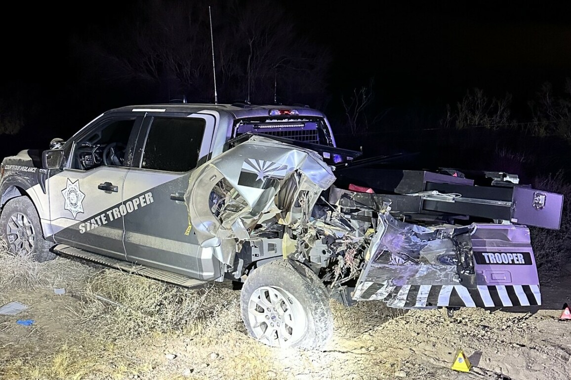 Truck towing trailer with 3 cars slams into Ariz. trooper along highway