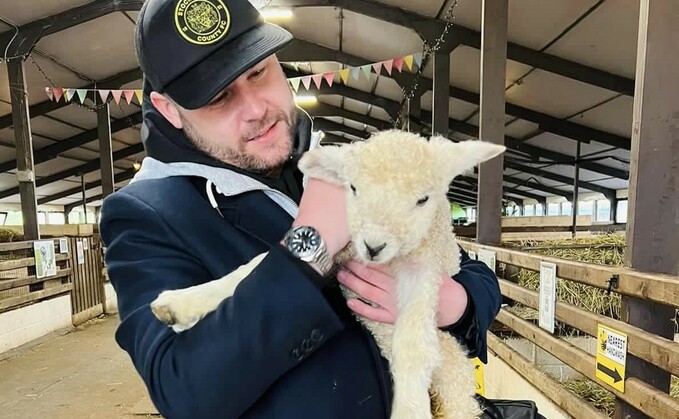 Danny Miller, who currently plays Aaron Dingle on Emmerdale, with a lamb at Tattershall Farm Park in Lincolnshire (danny_b_miller)