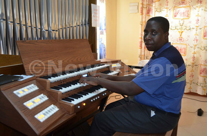  r onzaga ayanja plays the pipeorgan during a recital for the inauguration of t ecilia usic chool at outh ncounter aviour entre sambya