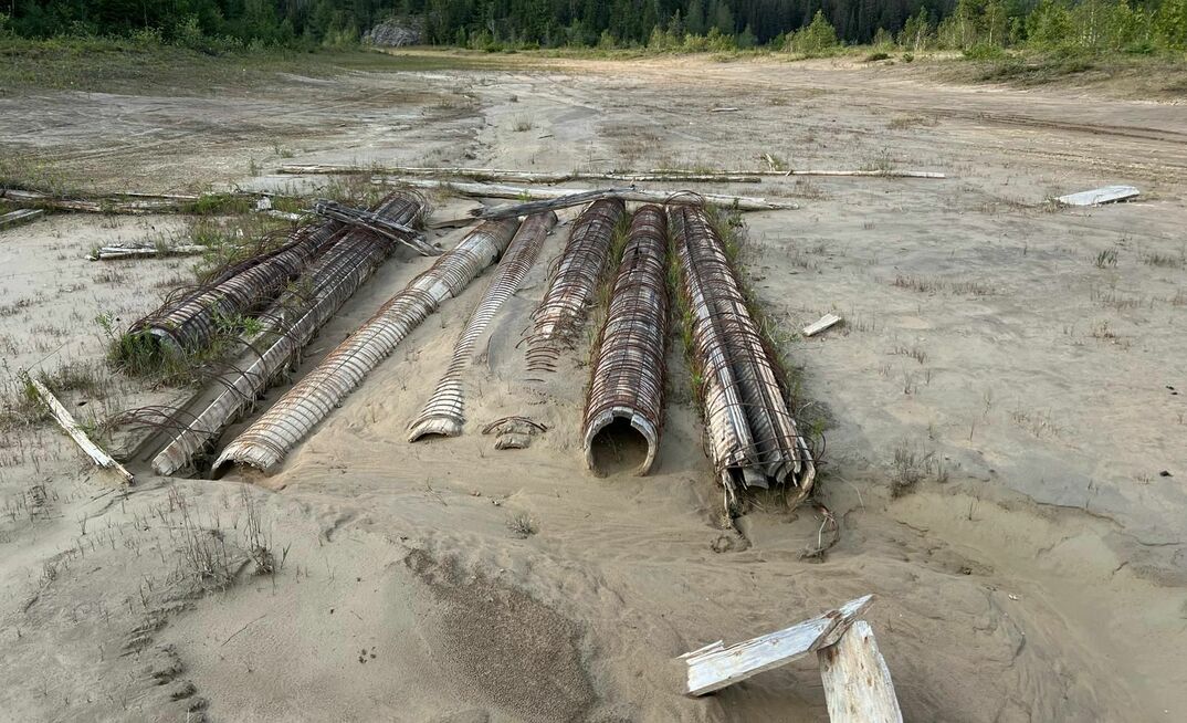 60 year old slurry pipes at the Teck Hughes northern tailings body. Photo: Fulcrum Metals