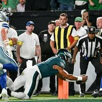 Eagles open title defense with tight win over Cowboys