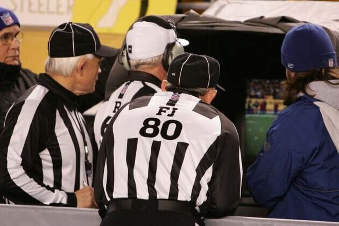 Replay officials throwing flags under consideration