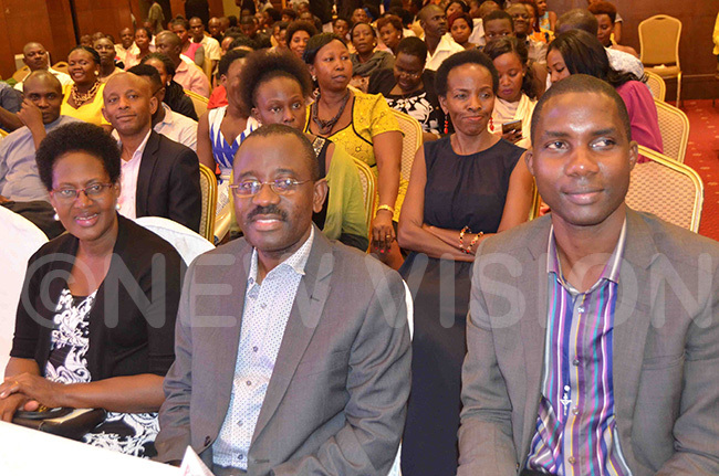  entenary ank fficials ellen sali odfrey yekwaso and rancis imbowa enjoying the show with other choral music fans