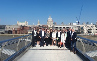 Participants in 'queue for nature and climate' pose for a photo on the Millenium Bridge | Credit: Cecilia Keating