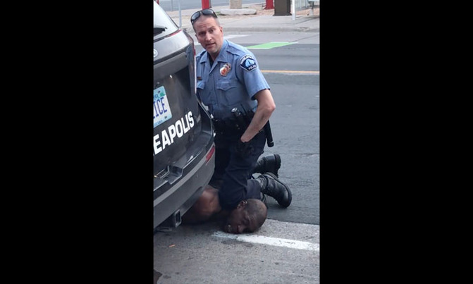 Officers sacked in US after black man dies as policeman kneels on neck Officers sacked in US after black man dies as policeman kneels on neck