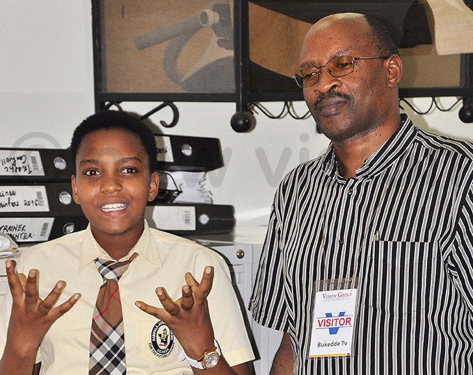 etrina rinda flanked by her father explains how she won the unday ision athers day promotion hoto by icholas neal