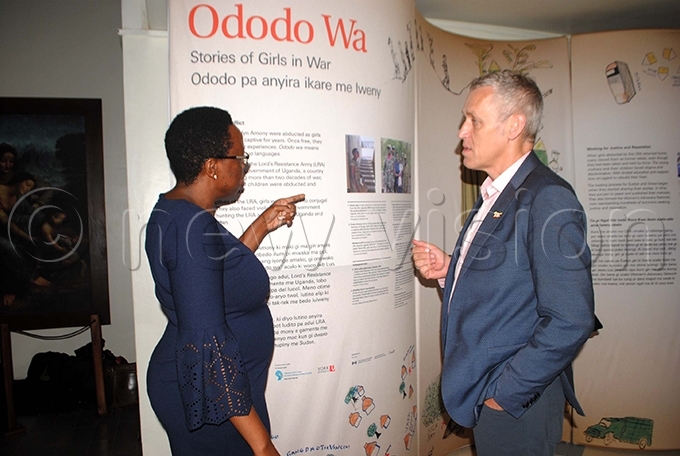 efugee aw rojects evota uwe chats with r hris olan at the launch at ganda useum hoto by ary ansiime
