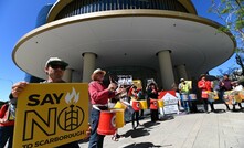 Protestors outside Woodside's headquarters this morning. 