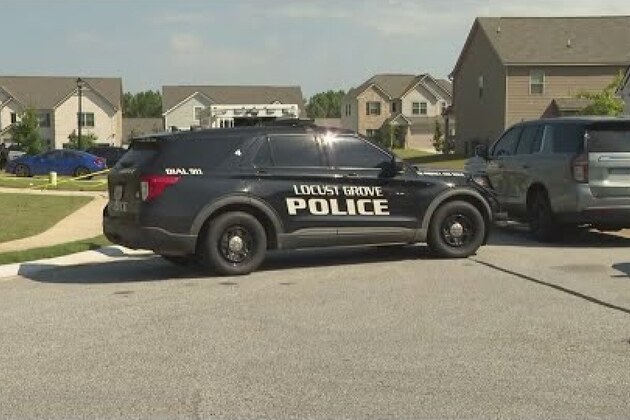 Police fatally shoot man in a burning Georgia house, find woman dead and others trapped