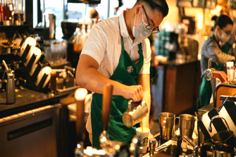Starbucks to beef up store staffing, go slow on automation rollout