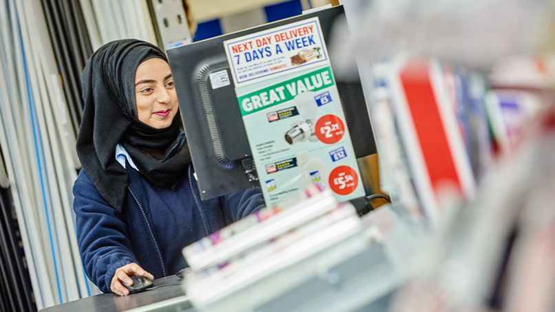 An employee at a Screwfix store in London