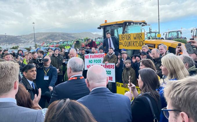 The Prime Minister told a crowd of protesting farmers at the Wales Conservative Conference that he 'had their backs'