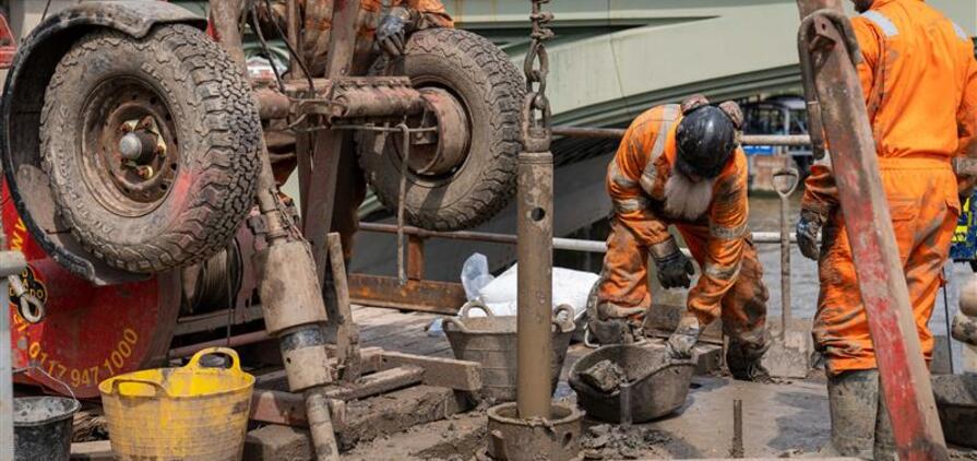 Engineers from Structural Soils conducted overwater drilling beside the Palace of Westminster using a jack-up barge on the River Thames