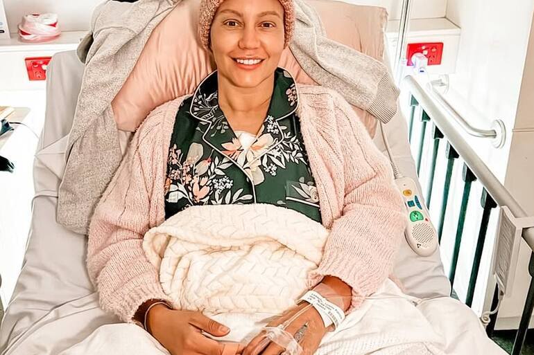 Footy legend Jude Bolton's TV star wife undergoes surgery in ongoing cancer battle