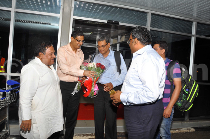  he senior rthopaedic doctor rathur  centre receives flowers from ajeev garwal second left as harmendra garwal right the chief finance officer of ogas and akash 